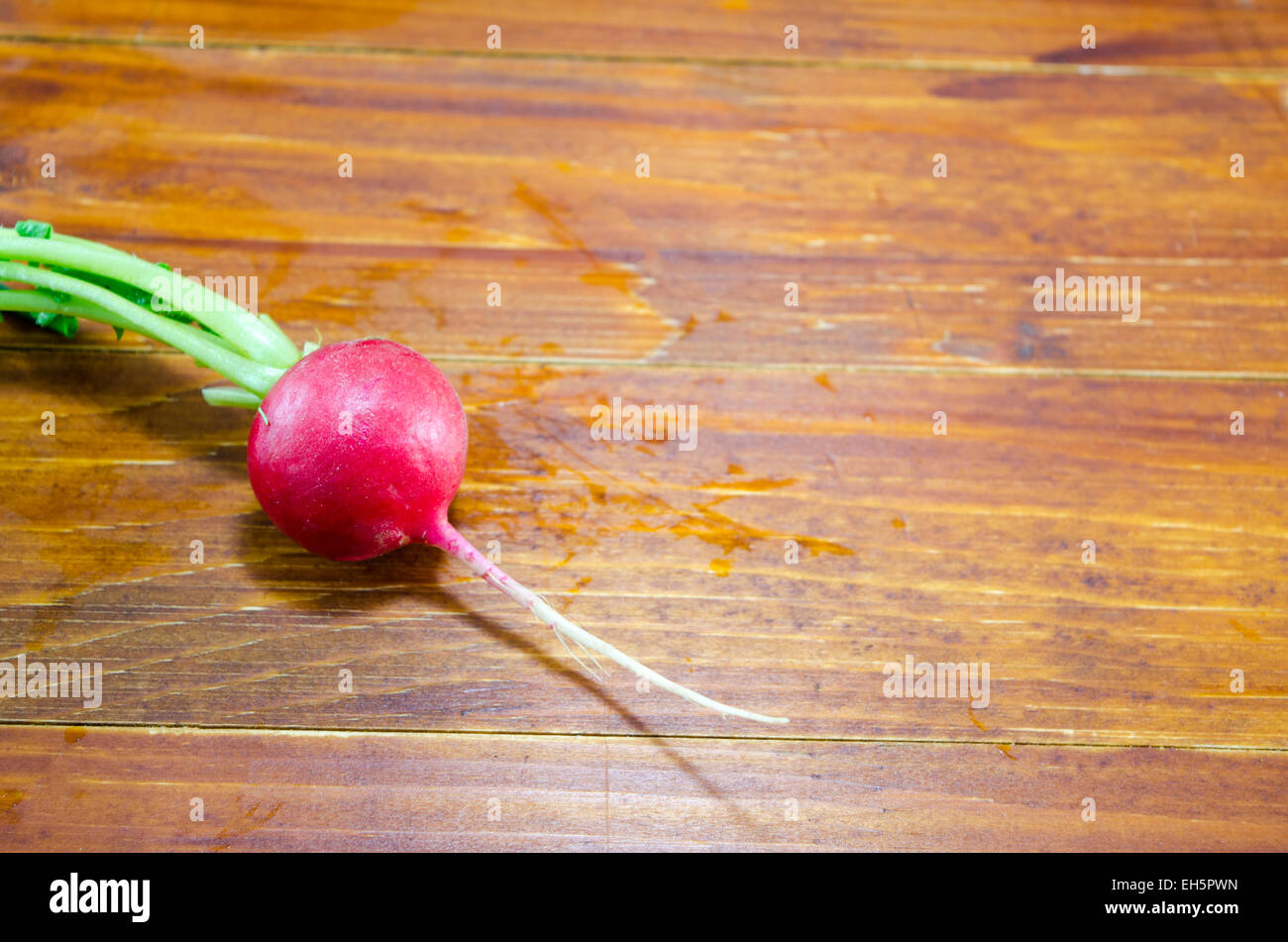 Fresh and moist radish on a wooden table Stock Photo