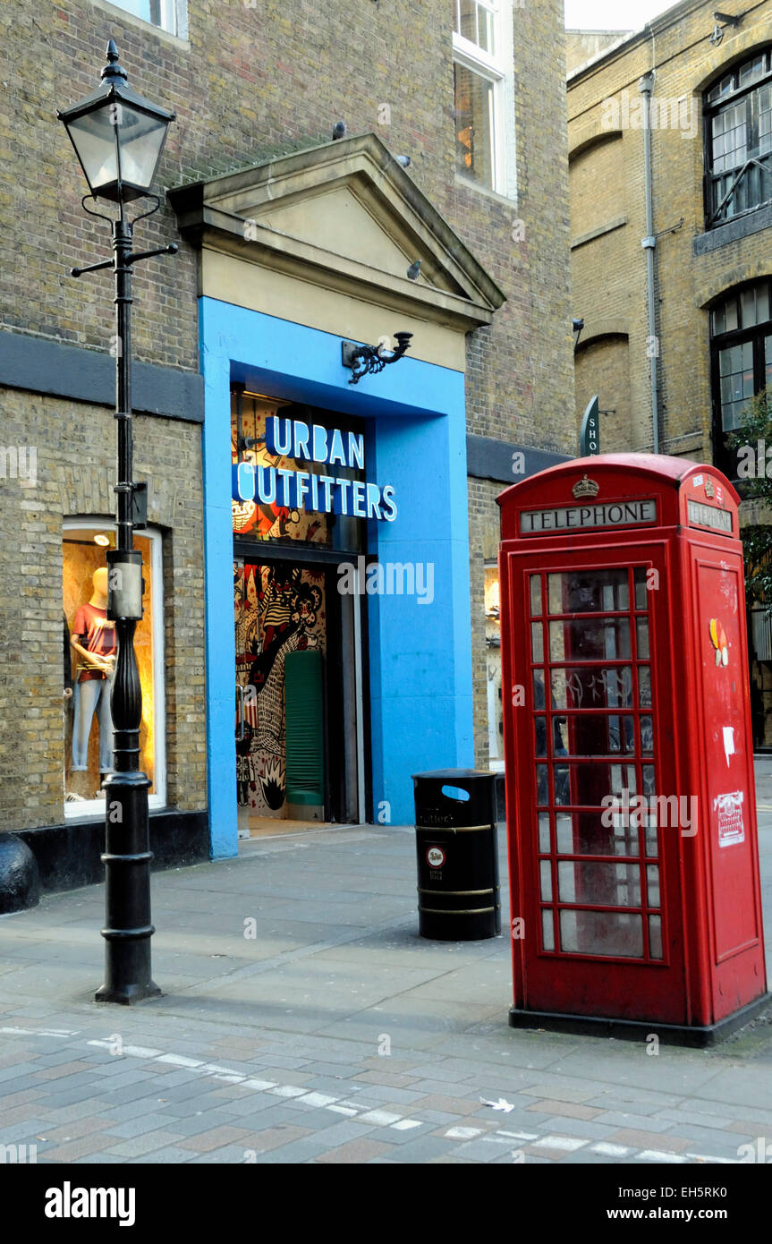 Urban Outfitters in very urban setting with red London telephone box