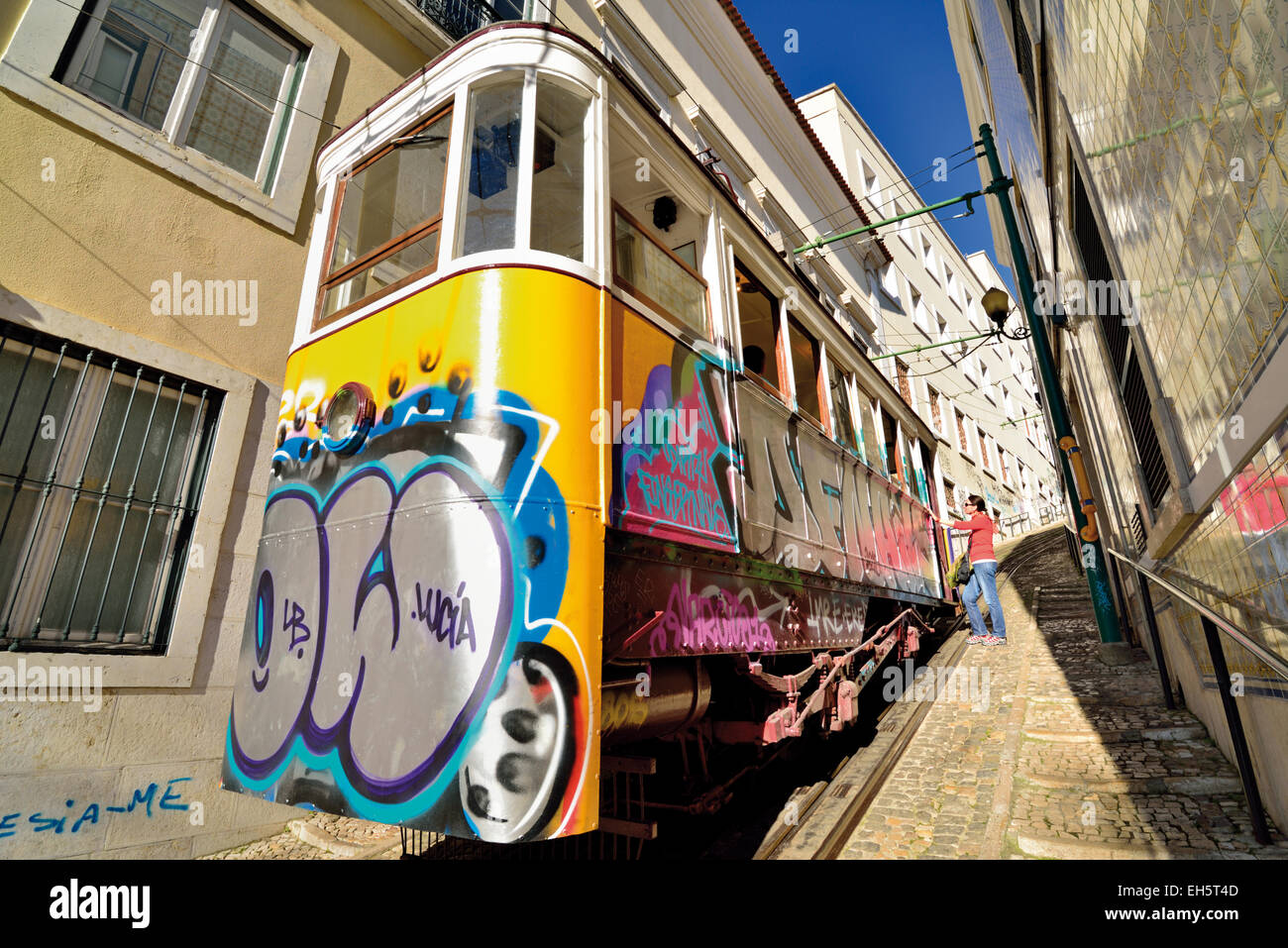 Portugal, Lisbon: Woman entering the historic elevator cable car Ascendor do Lavra Stock Photo