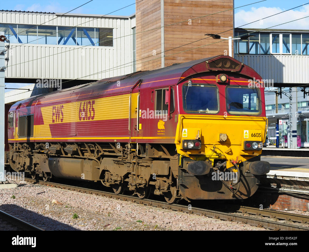EWS diesel locomotive class 66 leads a freight train through Peterborough, Cambridgeshire, England, UK Stock Photo
