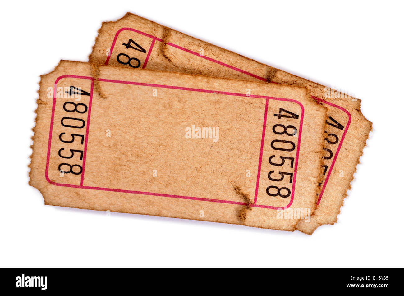 Pair of old torn blank raffle tickets on a white background. Stock Photo
