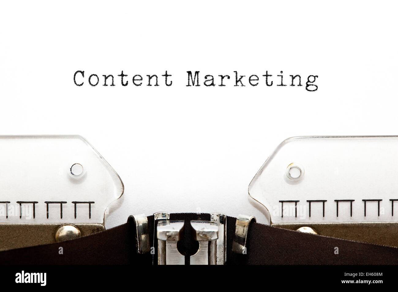 Content Marketing typed on white paper on old typewriter. Stock Photo
