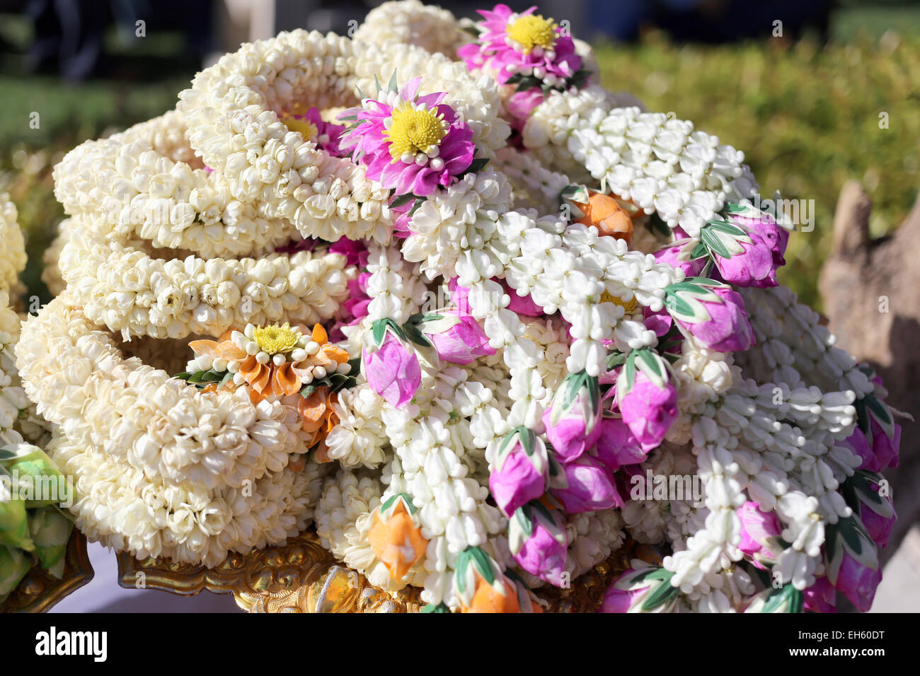 Garland of flowers in utensil for the worship. Stock Photo
