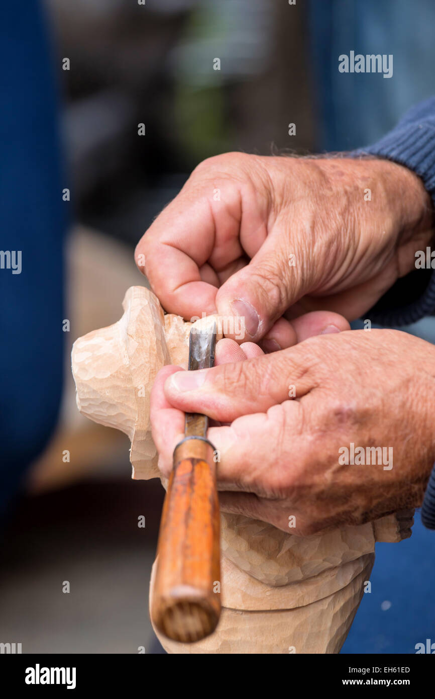 Skilful carver working in a small figure Stock Photo