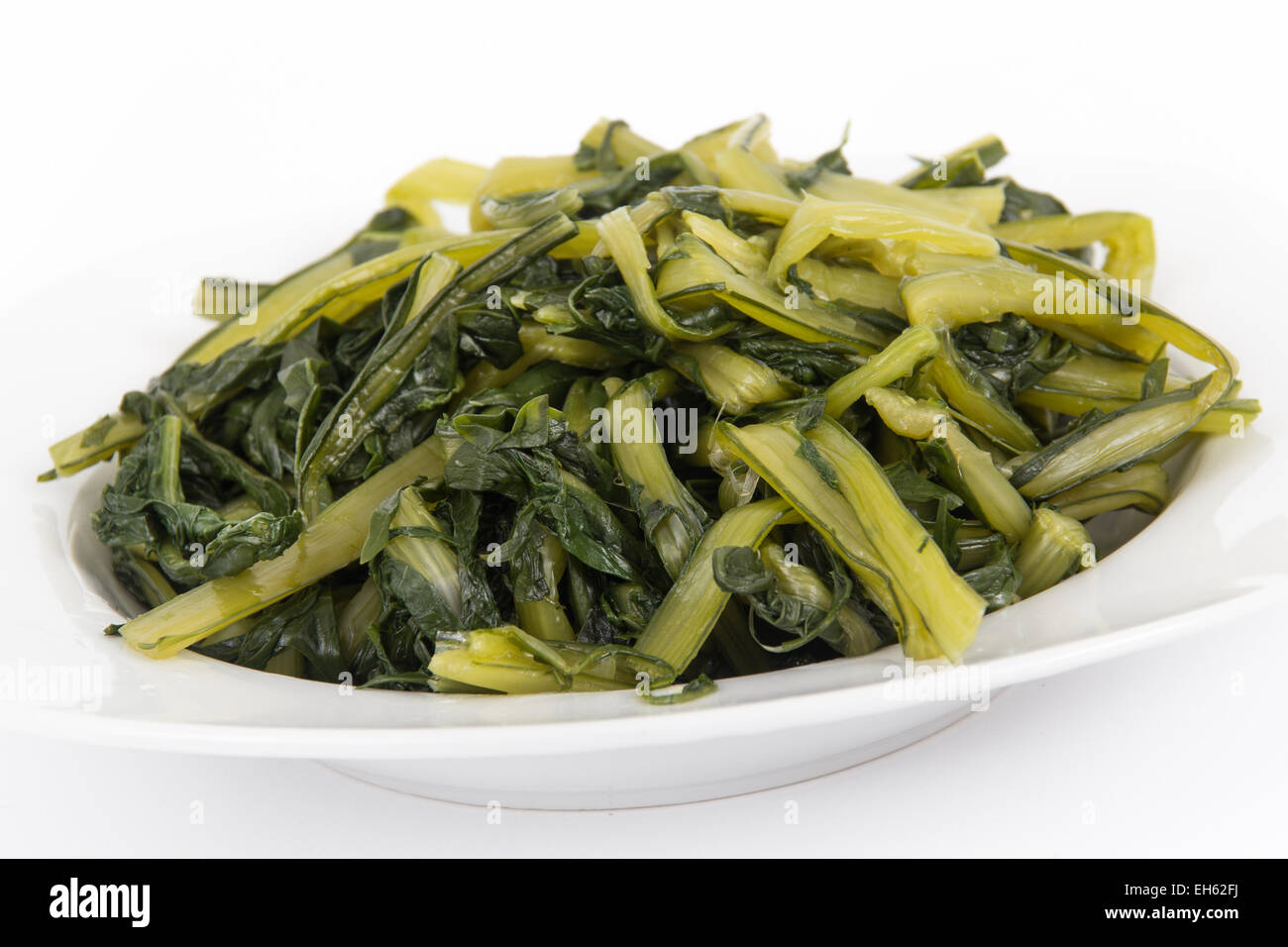 Prepared boiled dandelion greens bowl Stock Photo