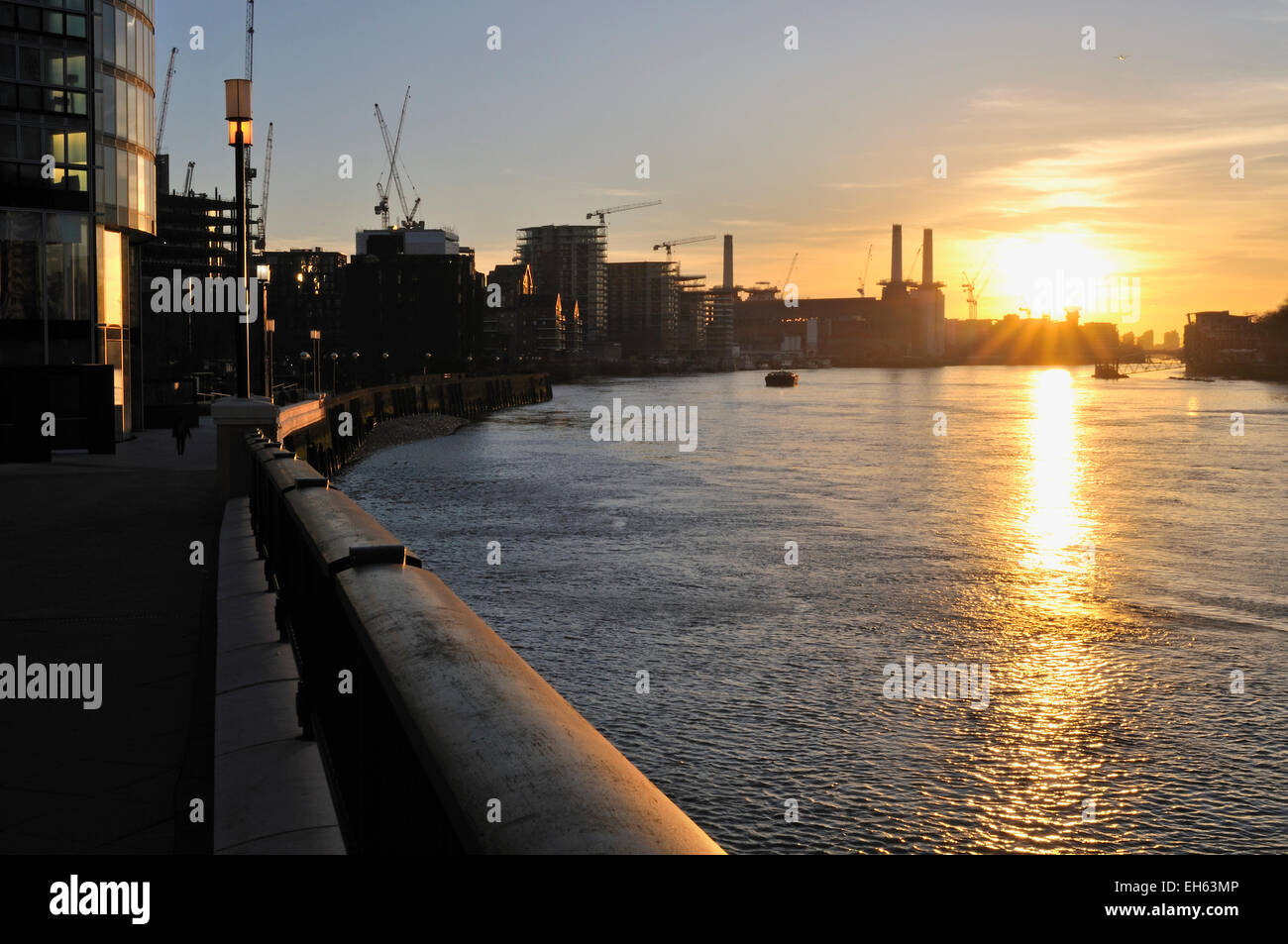 South Bank of the Thames at Vauxhall, London UK at dusk, looking towards Battersea. Stock Photo
