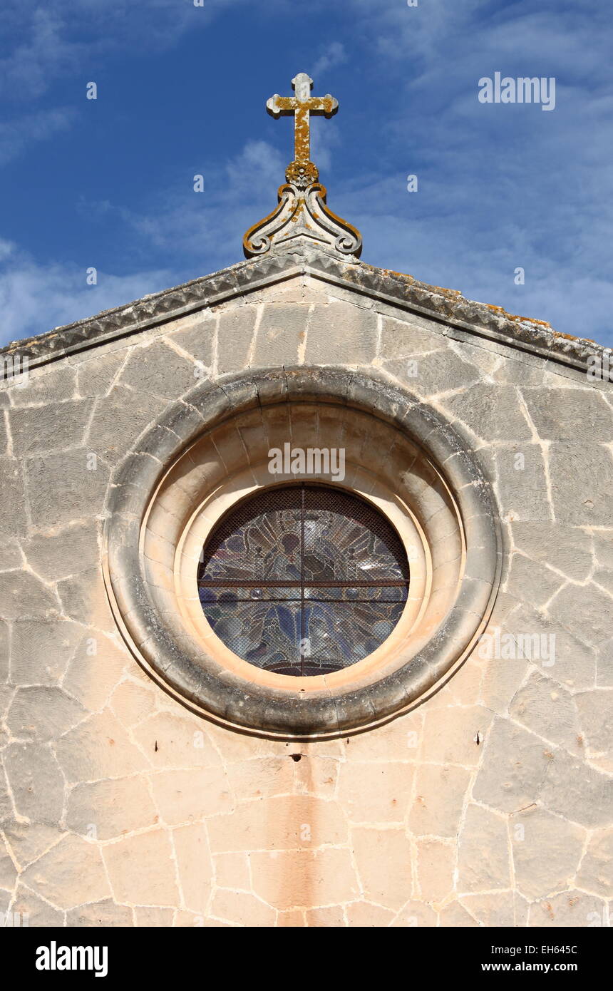 Cross on top of a medieval church Stock Photo