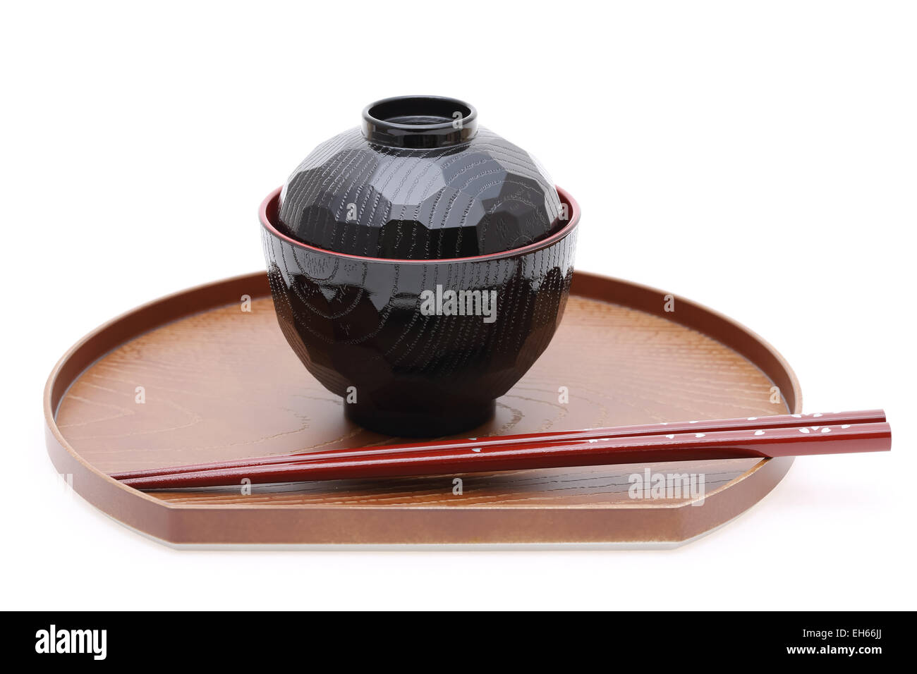 Traditional Japanese bowl and chopsticks isolated on white background