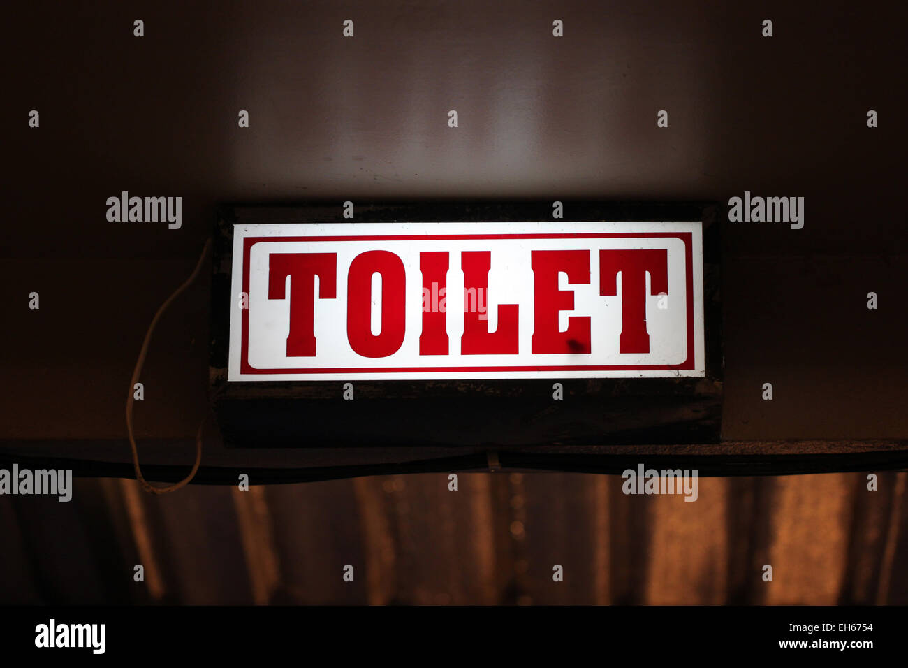 LED signs provide directional to the toilet. Stock Photo