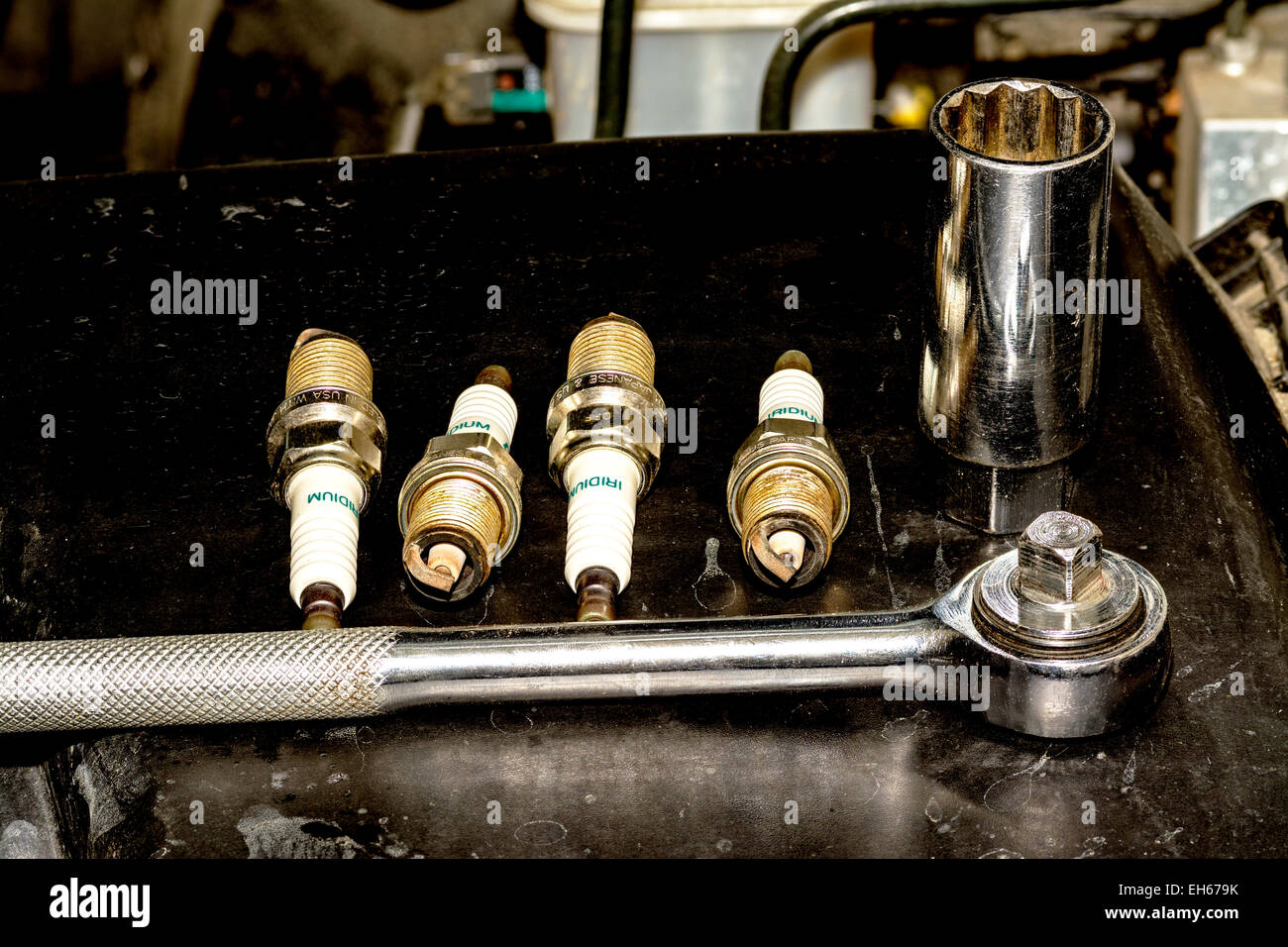 Mechanics tools with spark plugs Stock Photo