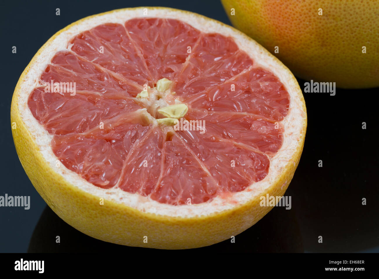 Yellow and pink grapefruit ready to be eaten Stock Photo Alamy