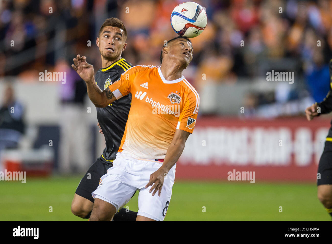 Houston, Texas, USA. 7th Mar, 2015. Houston Dynamo midfielder Luis Garrido (8) heads the ball during an MLS game between the Houston Dynamo and the Columbus Crew at BBVA Compass Stadium in Houston, TX on March 7th, 2015. The Dynamo won 1-0. © Trask Smith/ZUMA Wire/Alamy Live News Stock Photo