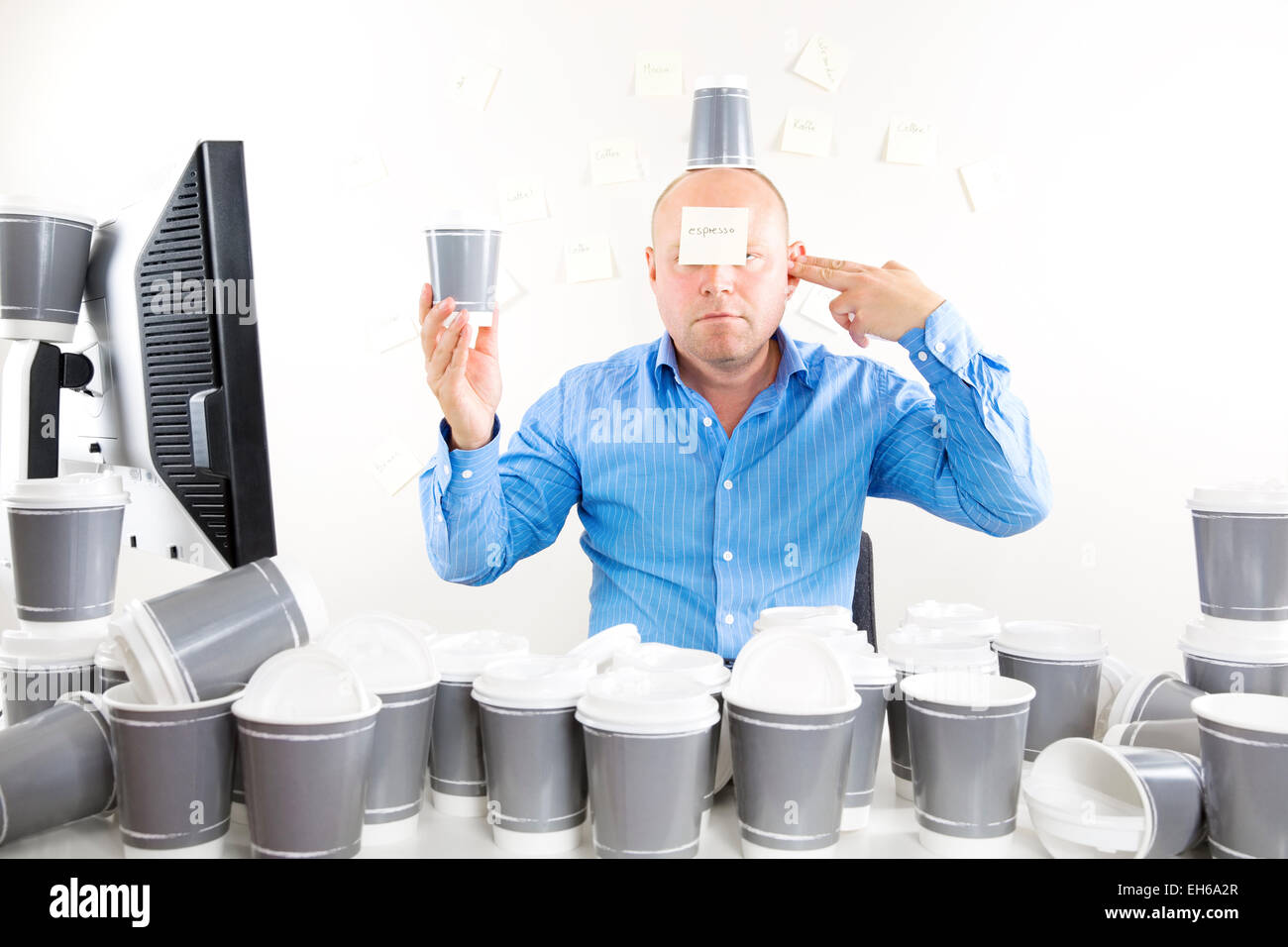 Businessman with coffee addiction Stock Photo
