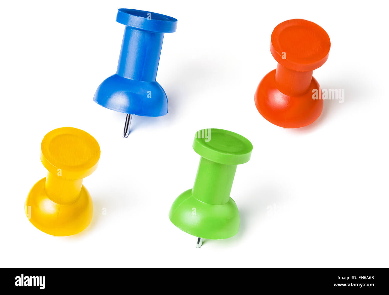 colorful push pins set with shadows isolated on white Stock Photo