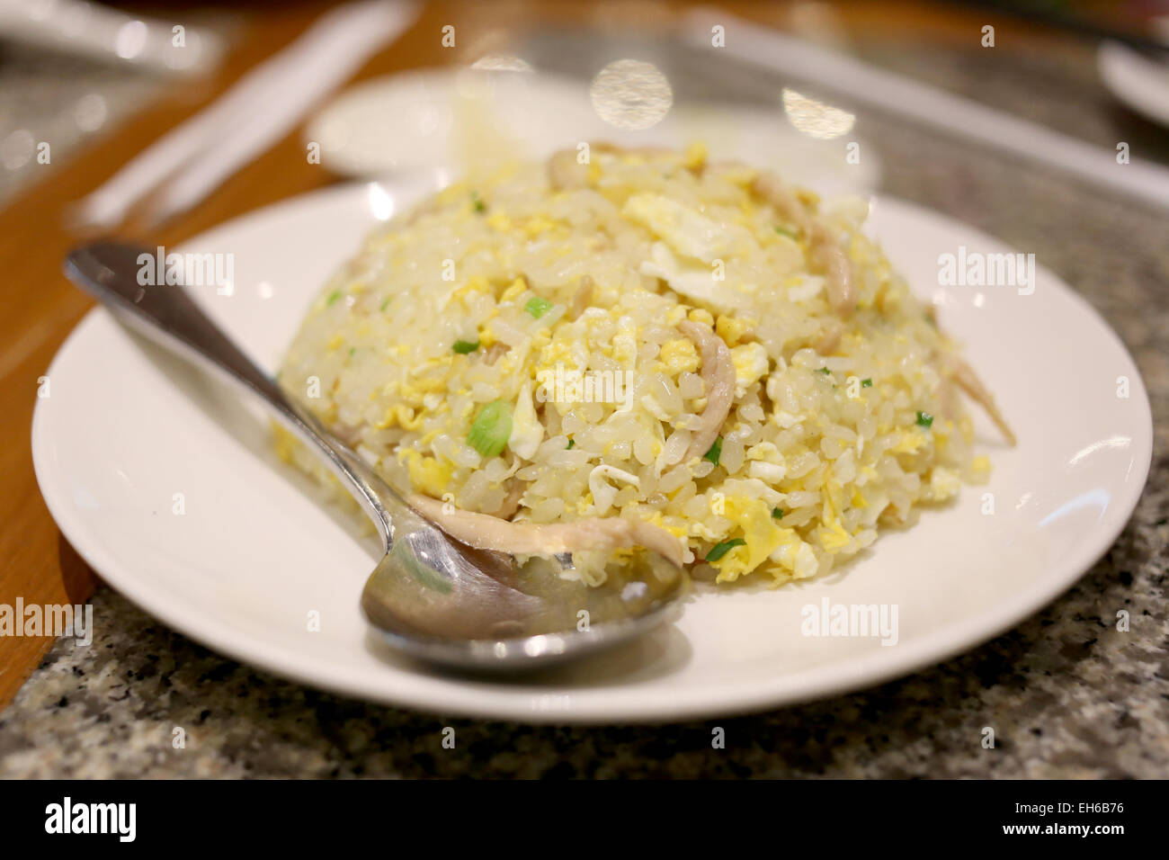 Fried rice on white dish at the restaurant. Stock Photo