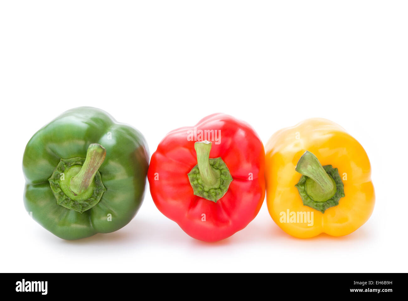 green and red and yellow bell peppers on a white background Stock Photo ...