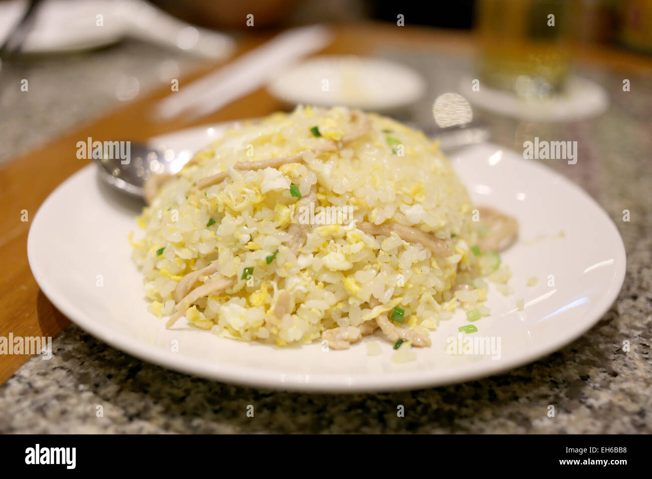 Fried rice on white dish at the restaurant. Stock Photo