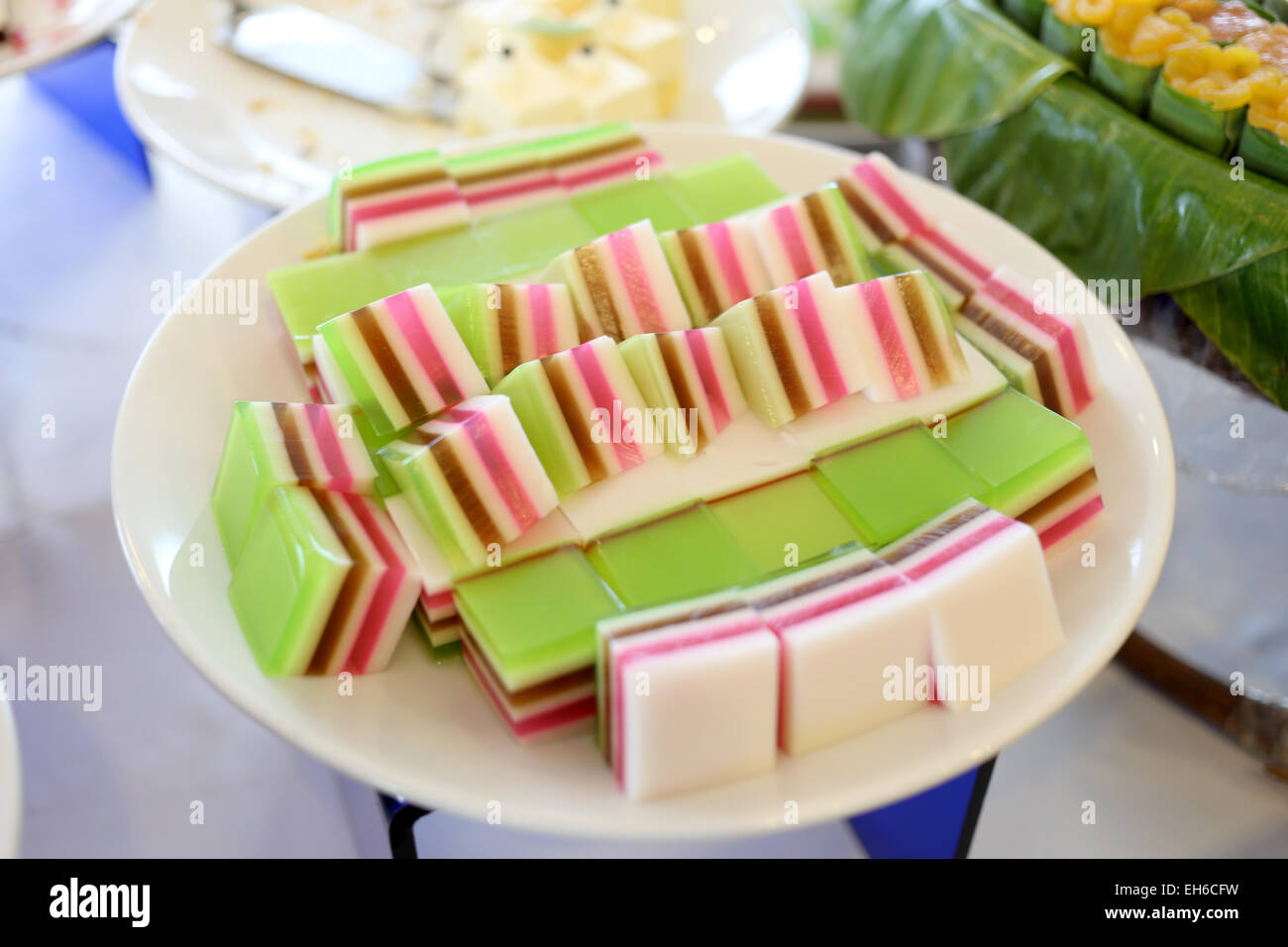 Desserts of colorful on dish in the restaurant. Stock Photo