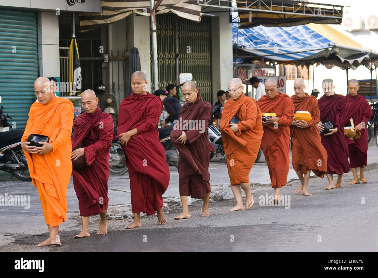 Monks on the way requesting donations in Ho Chi Minh City (Saigon), Vietnam, Southeast Asia Stock Photo