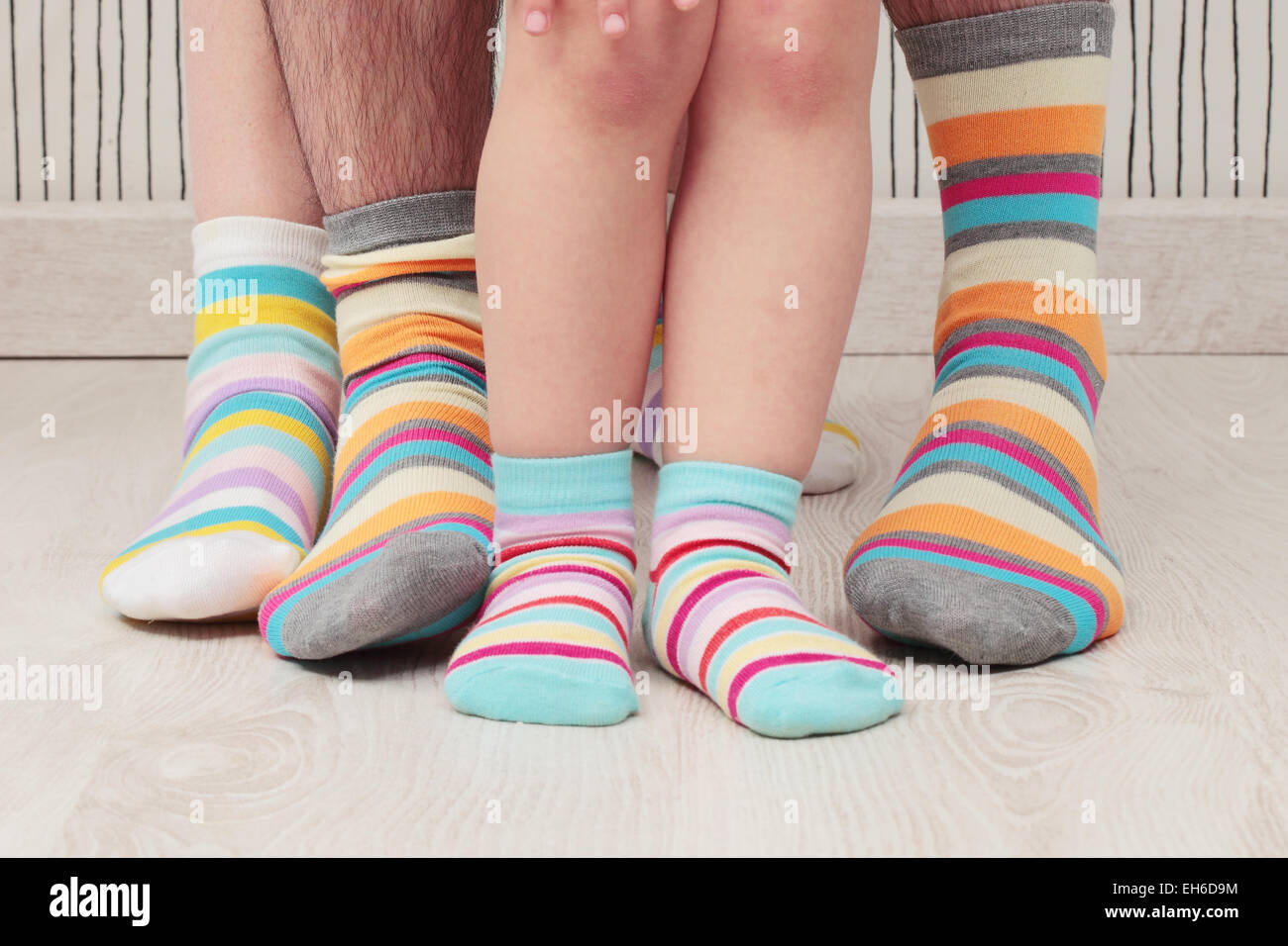 dad, mom and daughters with socks Stock Photo Alamy