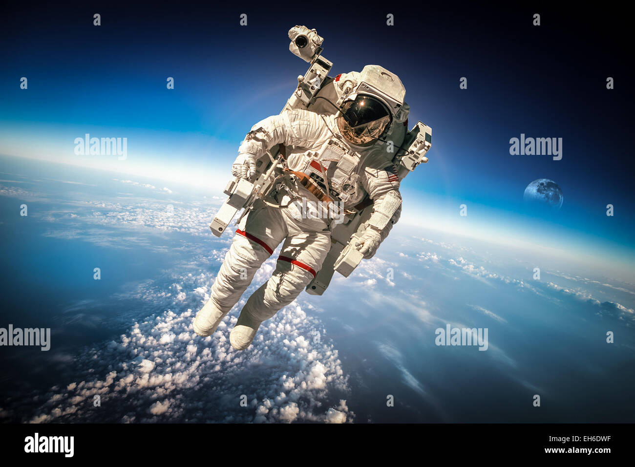 Astronaut in outer space against the backdrop of the planet earth. Elements of this image furnished by NASA. Stock Photo