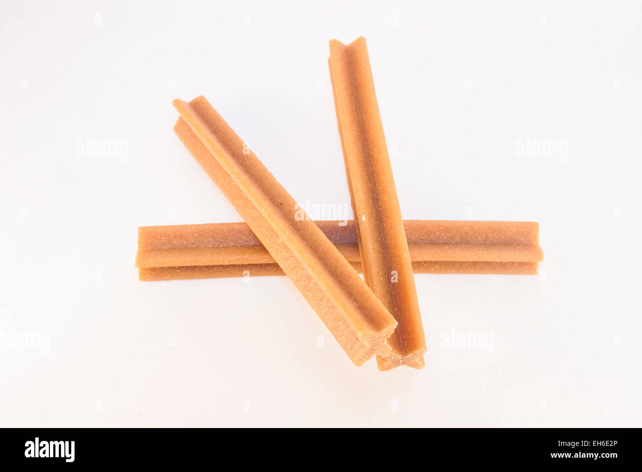 Dental stick for a dog, isolated on white background Stock Photo - Alamy