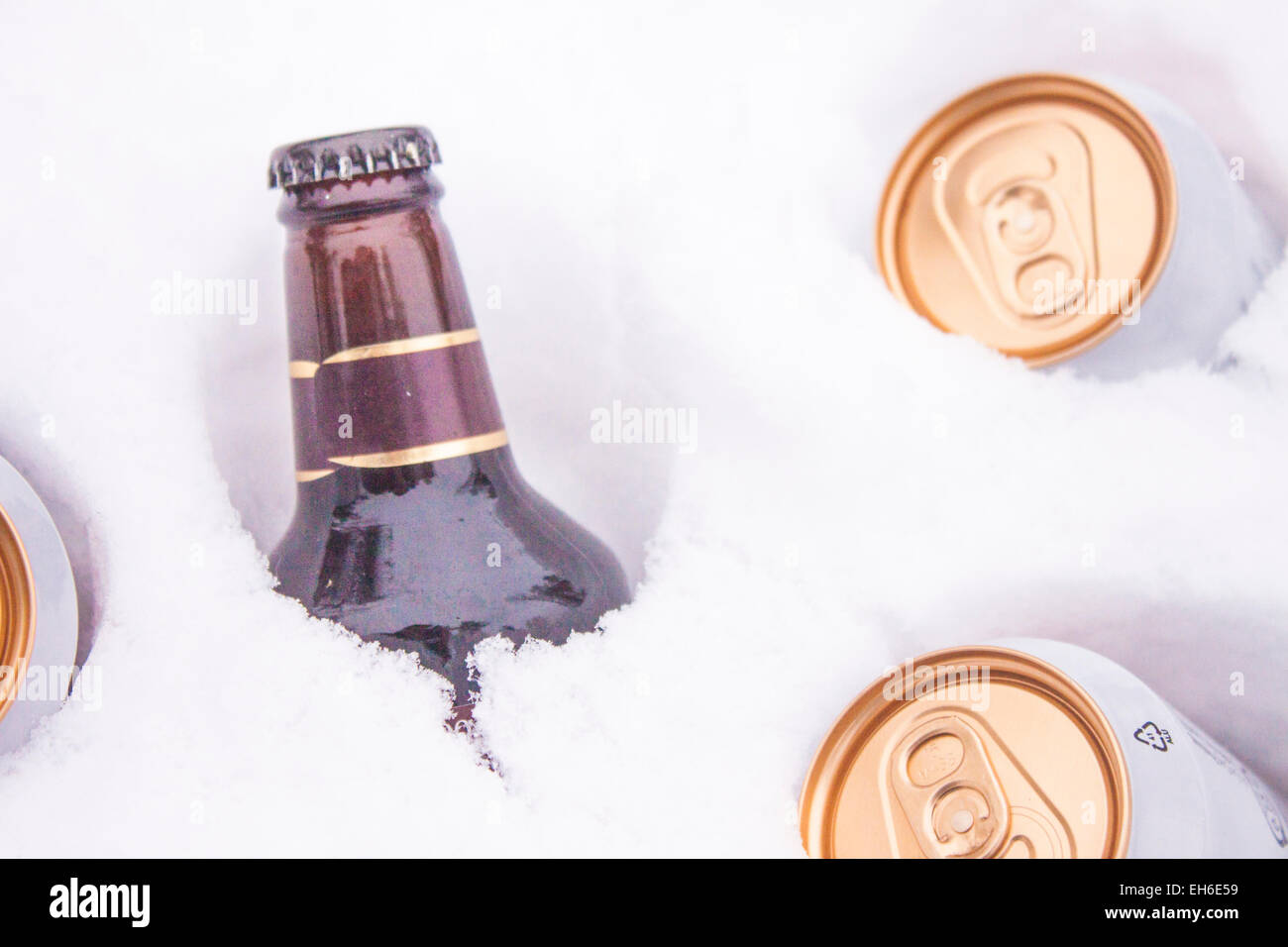 Bottles of cold beer in white snow Stock Photo