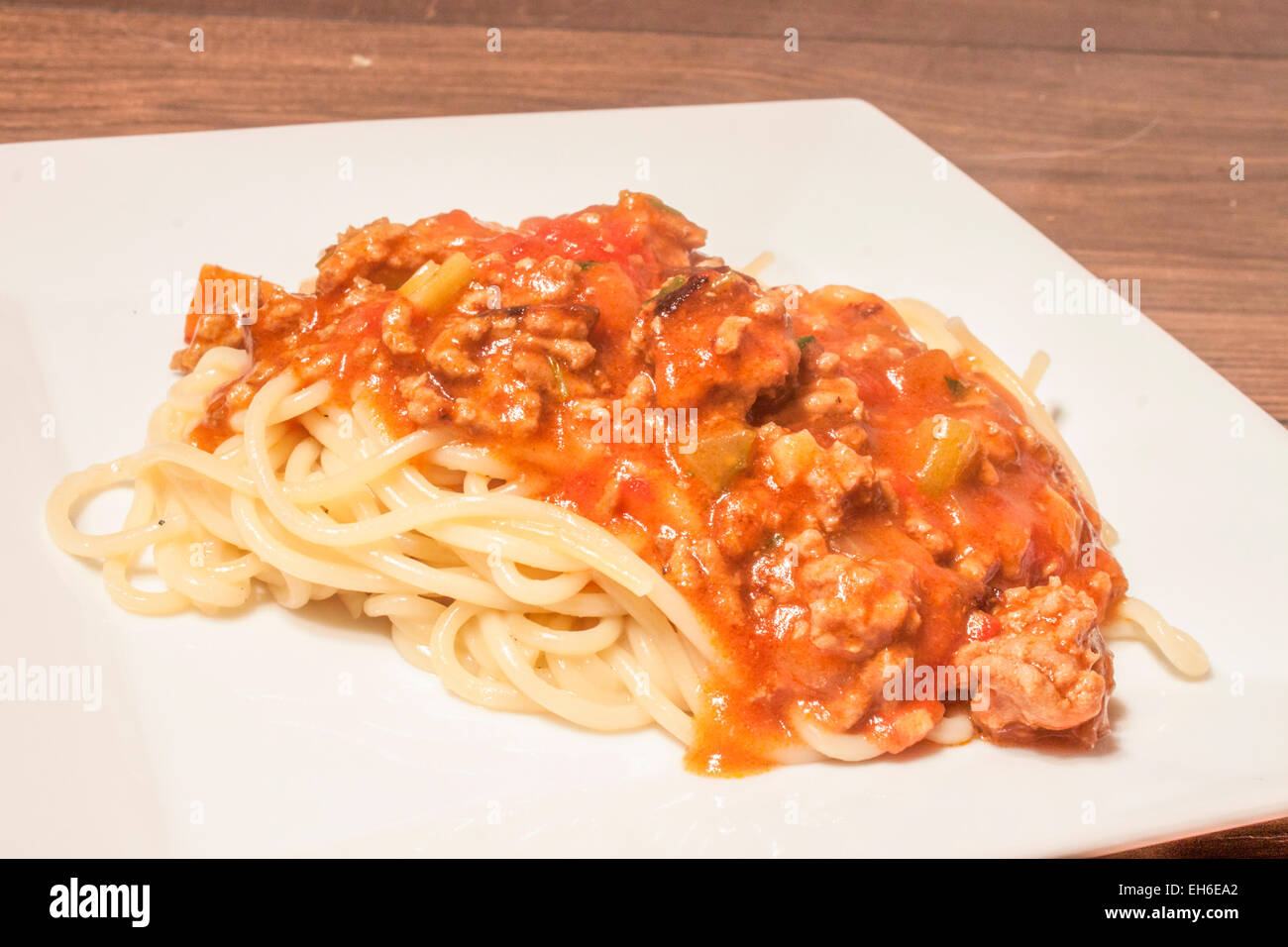 Spagetti bolognaise, on a white plate. In the kitchen Stock Photo
