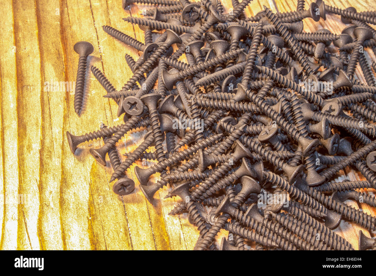Black drywall screws isolated on white Stock Photo - Alamy