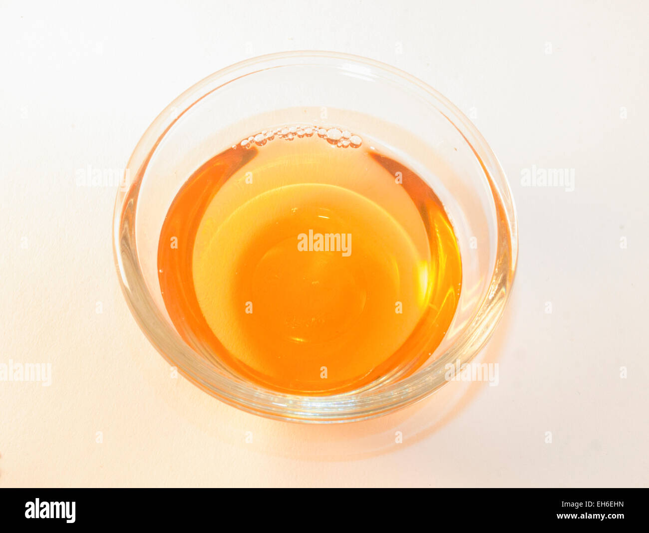 Orange apple vinegar, whit a hint of honey. Isolated on white background Stock Photo