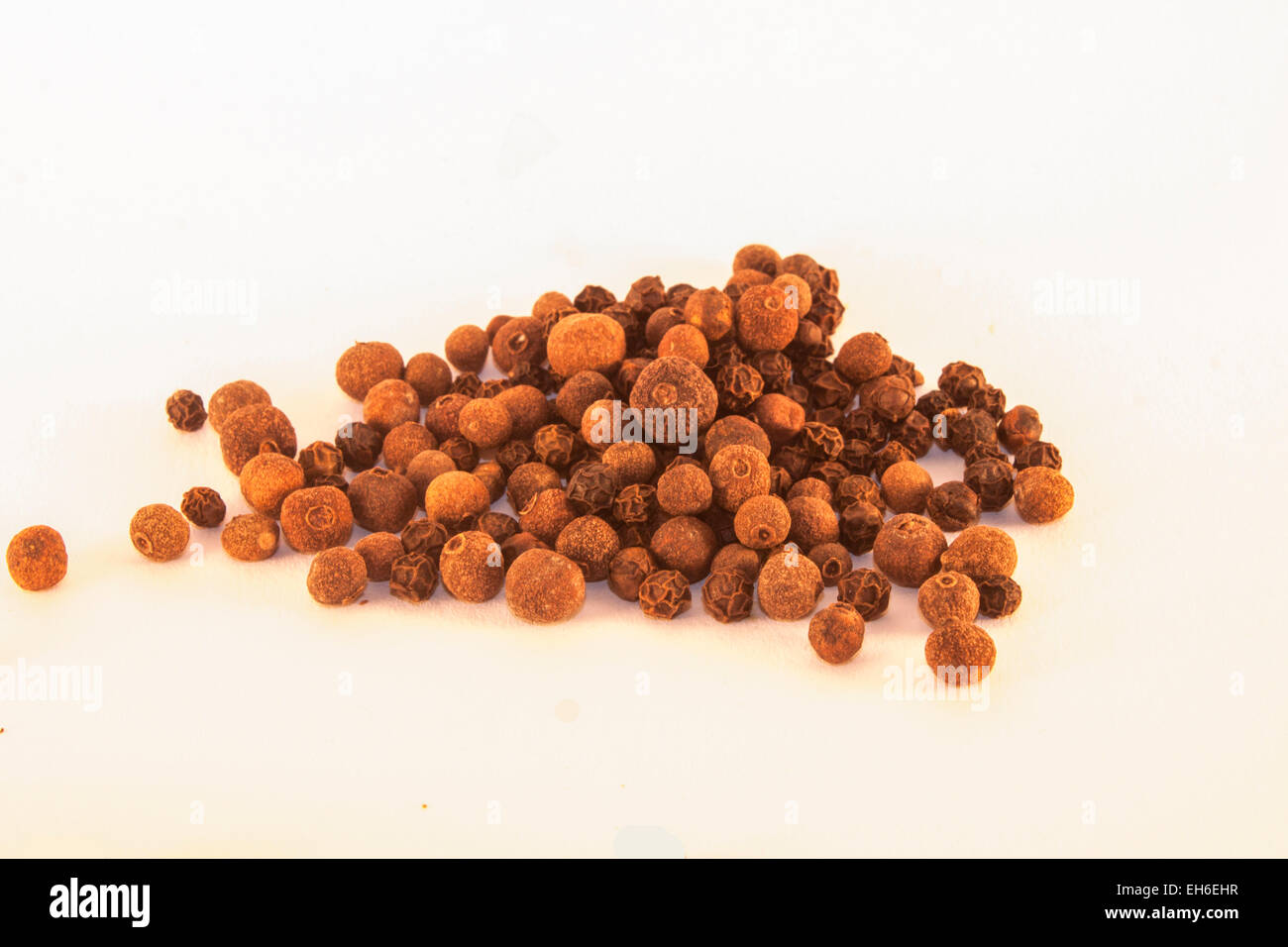 A lot of allspice, isolated on white background Stock Photo Alamy