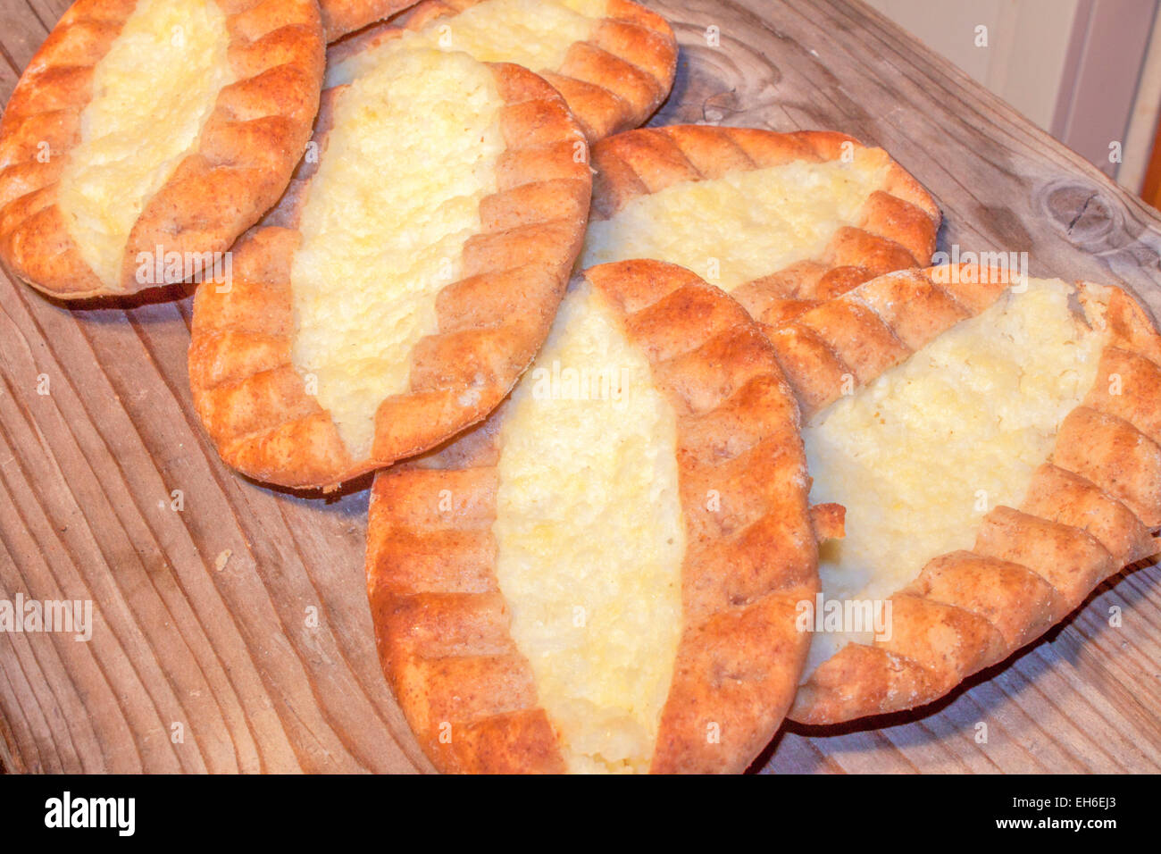 Few karelian pastry, on a wooden table Stock Photo