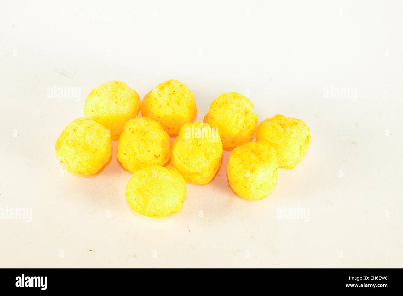 Yellow cheese balls, isolated on white background Stock Photo