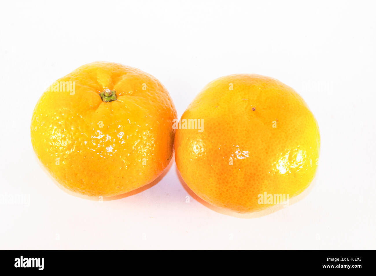Two yellow satsumas, isolated on white background Stock Photo Alamy