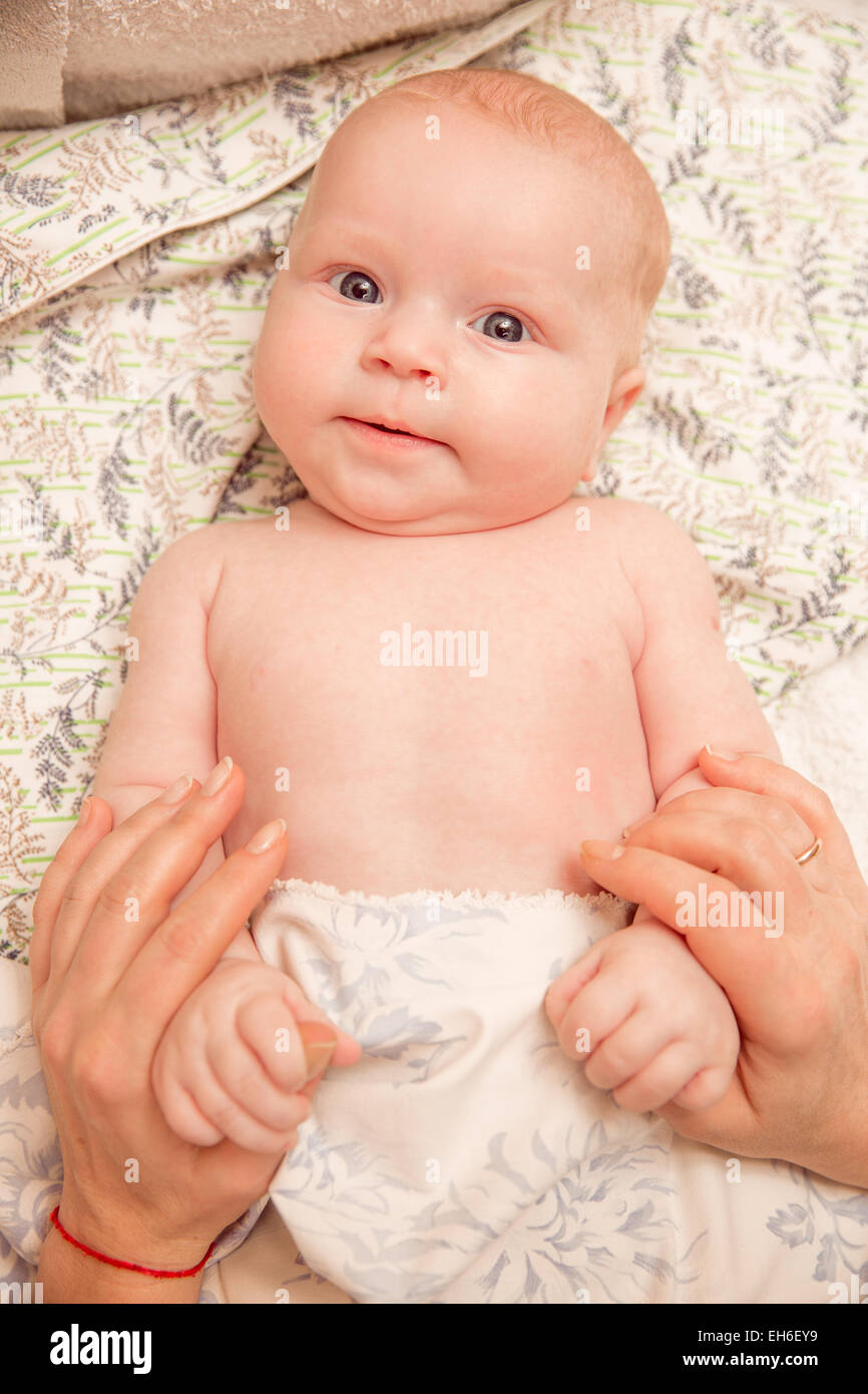 Twomonth old baby girl on a light background Stock Photo Alamy
