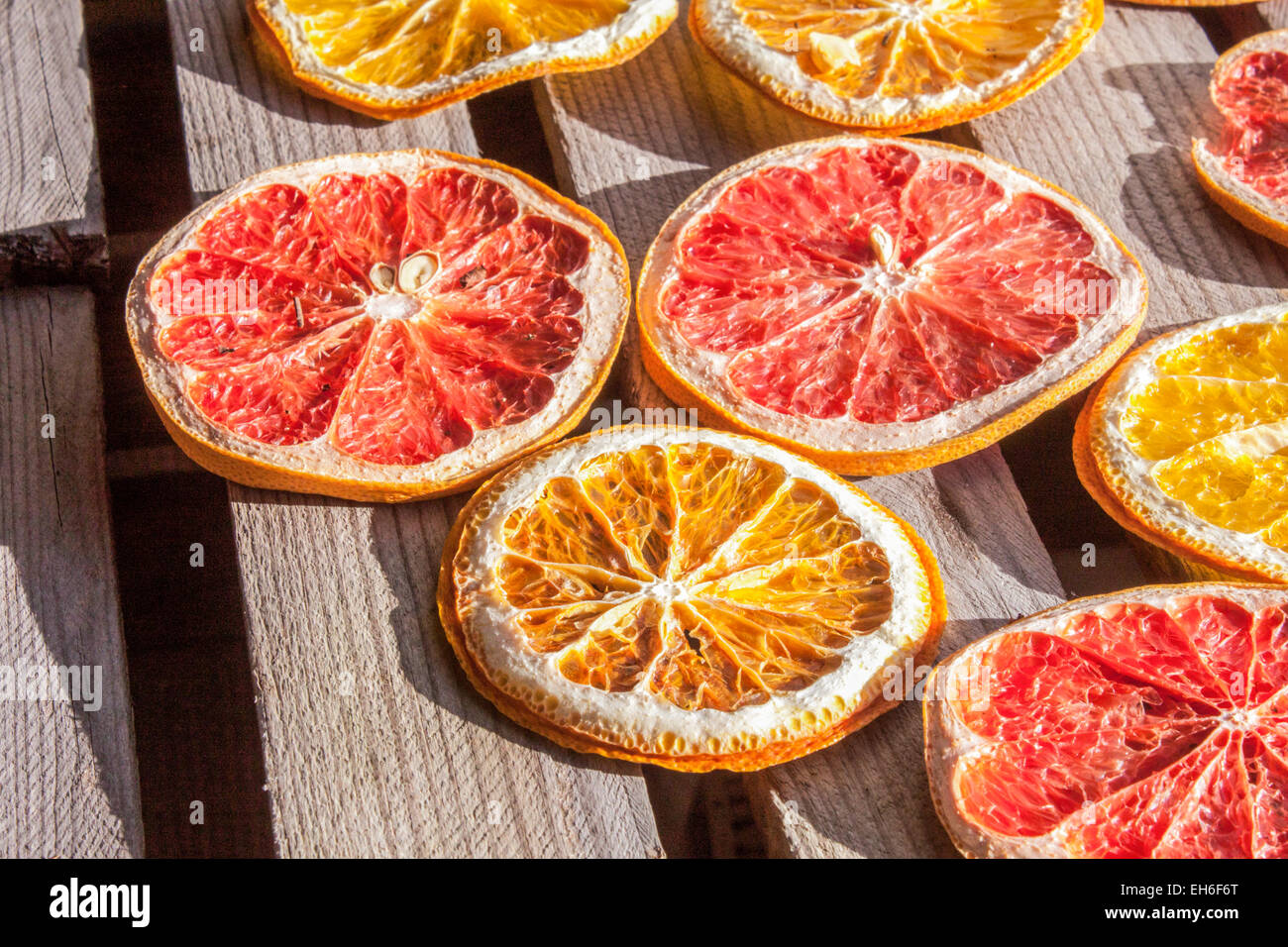 Dried red, blood, grape and yellow orange, on wooden background Stock Photo