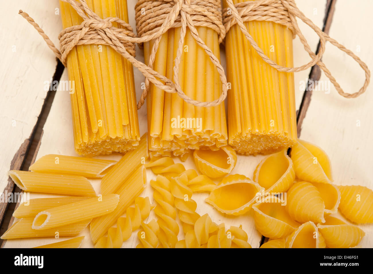 bunch of Italian pasta type on a white rustic table Stock Photo