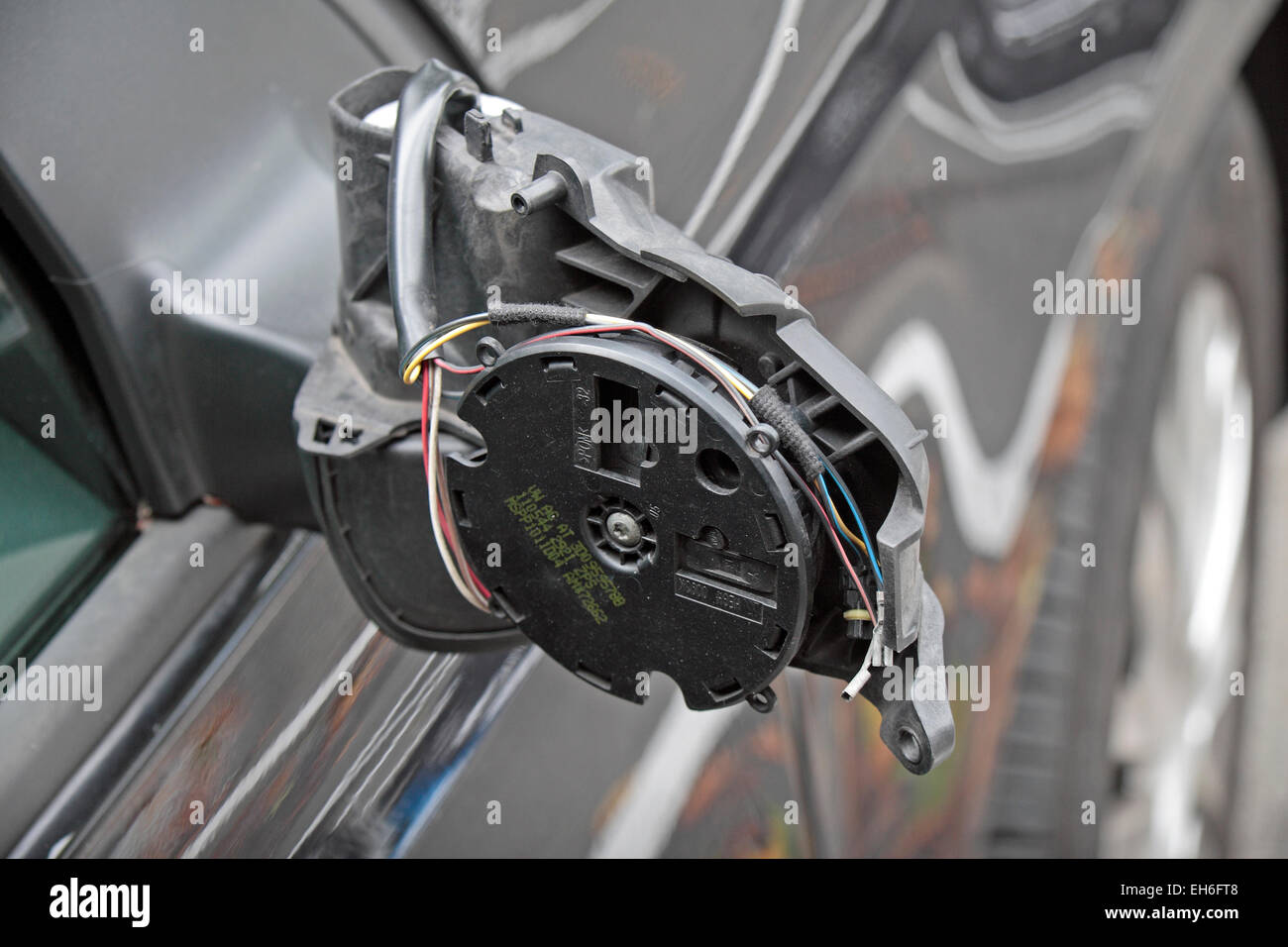 A smashed wing mirror on a car parked in Brussels, Belgium Stock Photo