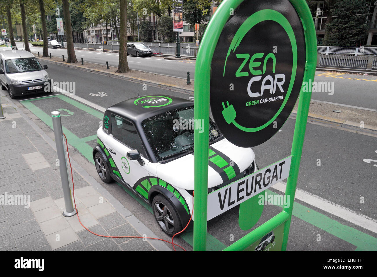 A Zen Car (car sharing) electric car plugged in to a road side power