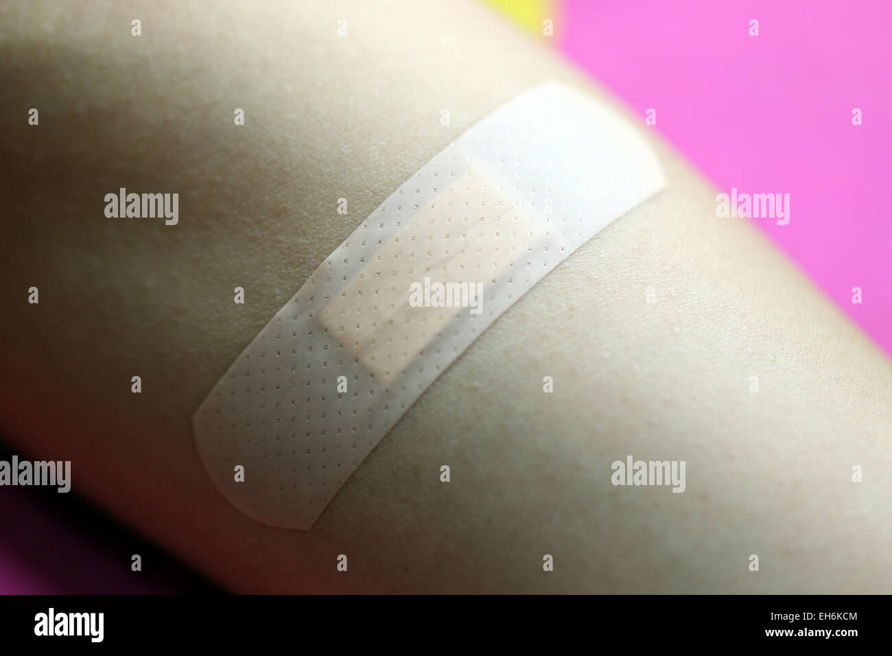 Adhesive plaster on skin of women. Stock Photo