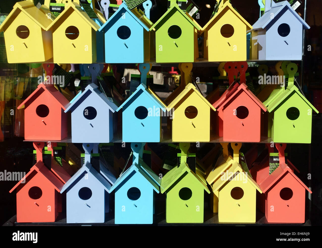 Coloured bird boxes in London shop window Stock Photo