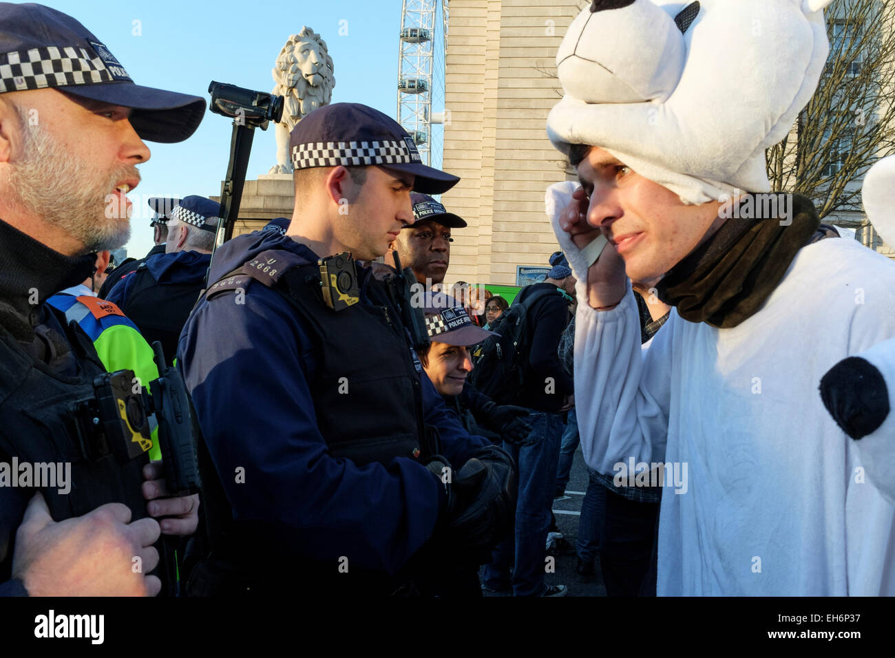 London, UK. 7th March, 2015  'Time for Action' march.  Pictured: Metropolitan police officers confront demonstrators following  rally in Westminster. Stock Photo