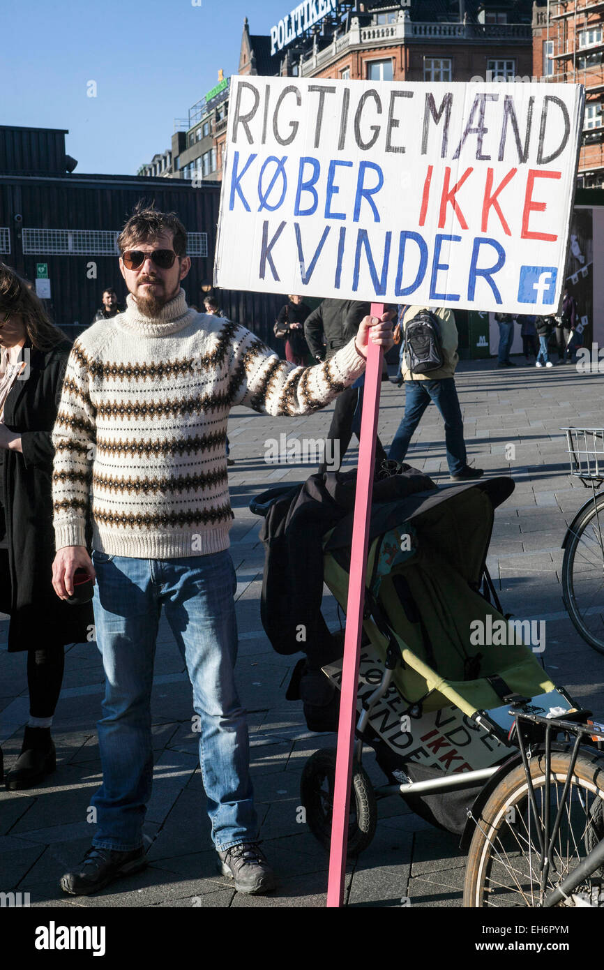 Copenhagen, Denmark. 8th March, 2015. “Real men don’t buy women” reads this sign from the rally in celebration in Copenhagen of the International women’s Day Credit:  OJPHOTOS/Alamy Live News Stock Photo