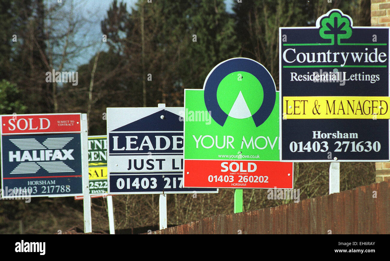Estate agent's boards for sale and to let Stock Photo
