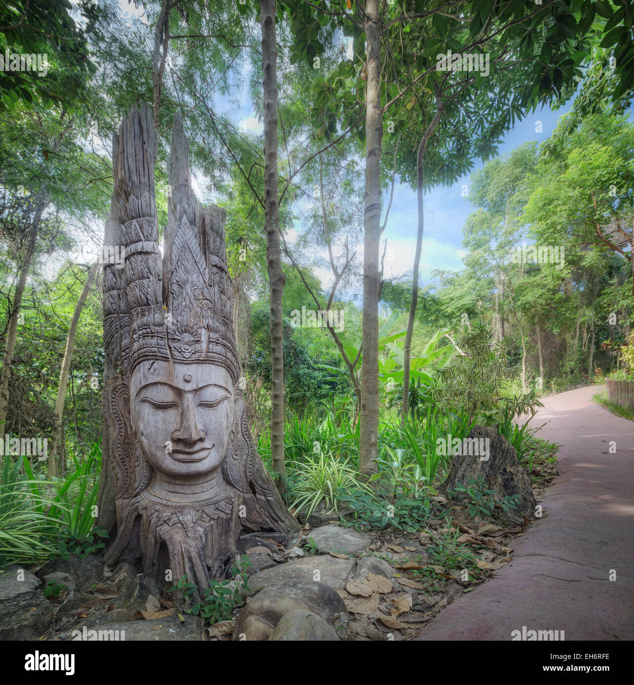 Old ancient buddha statue on wooden background Stock Photo - Alamy