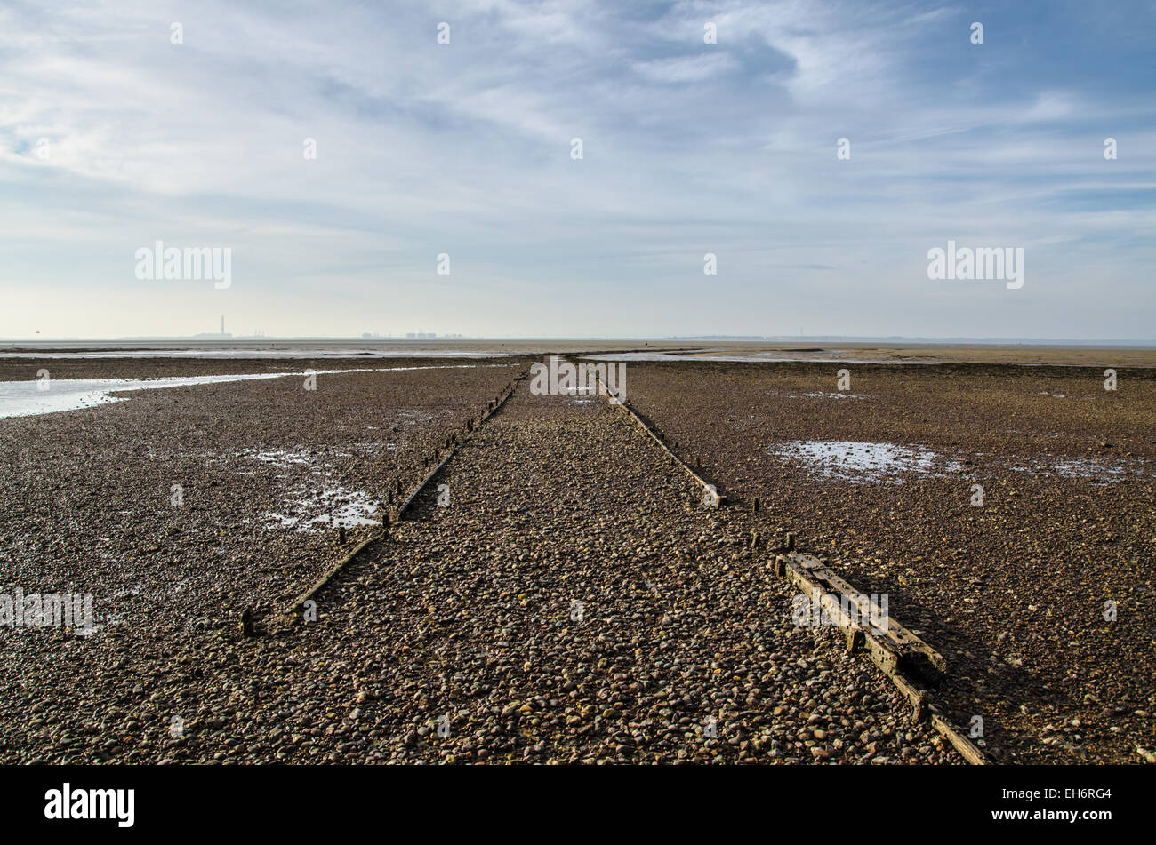 The tide recedes a mile from the shore in the Southend on Sea area at low tide leaving vast areas of mud exposed in the Thames Estuary. Space for copy Stock Photo