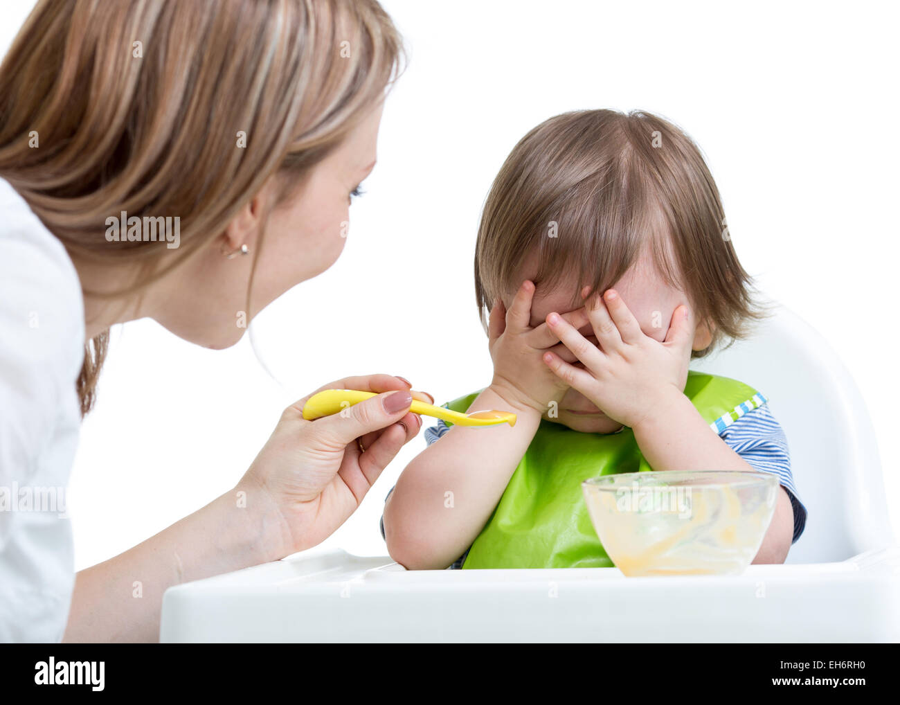 Little boy refuses to eat closing face by hands Stock Photo