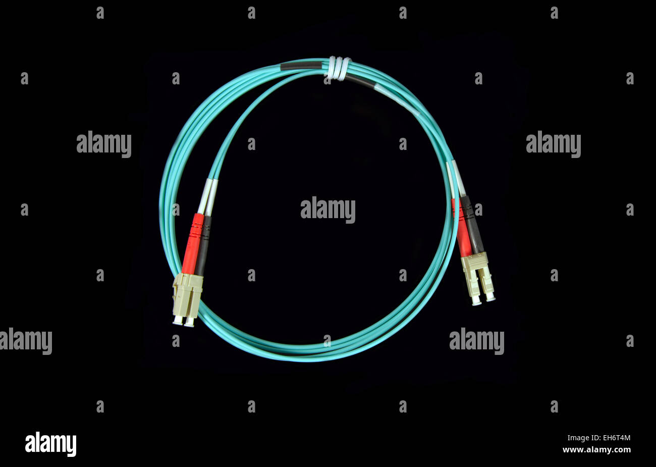 Blue fiber patch cable with LC connectors in the both ends Stock Photo