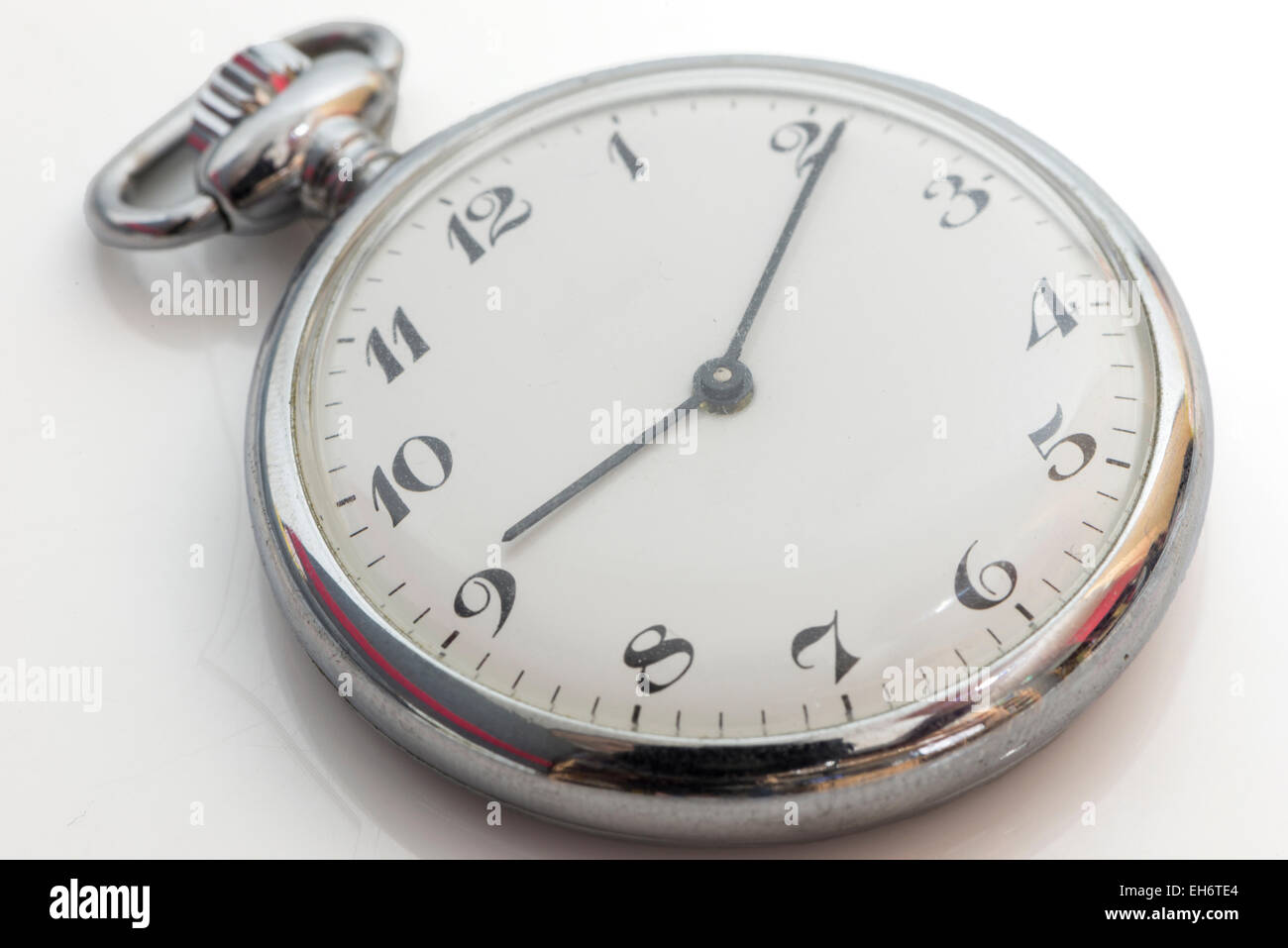 old clock on a white background Stock Photo - Alamy