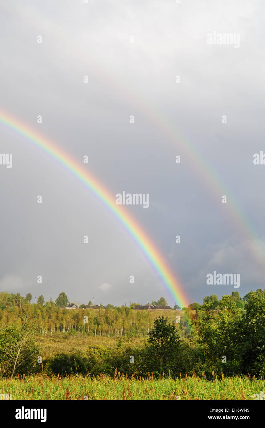 Village rainbow landscape Stock Photo - Alamy